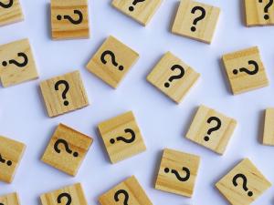 square wood tiles with question marks