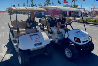 Students in a golf cart