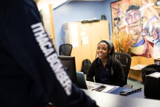 Person smiling in conversation.