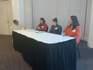 Panelists at a table
