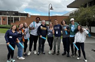 Groups of ten students posing and wearing IC gear